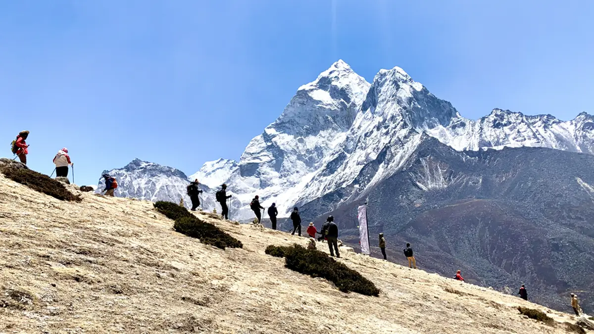Acclimatization day mountain view trail between Dingboche to Nangkartshang Hill top and downhill way back the mountain view of mount Ama Dablam Everest region Nepal.