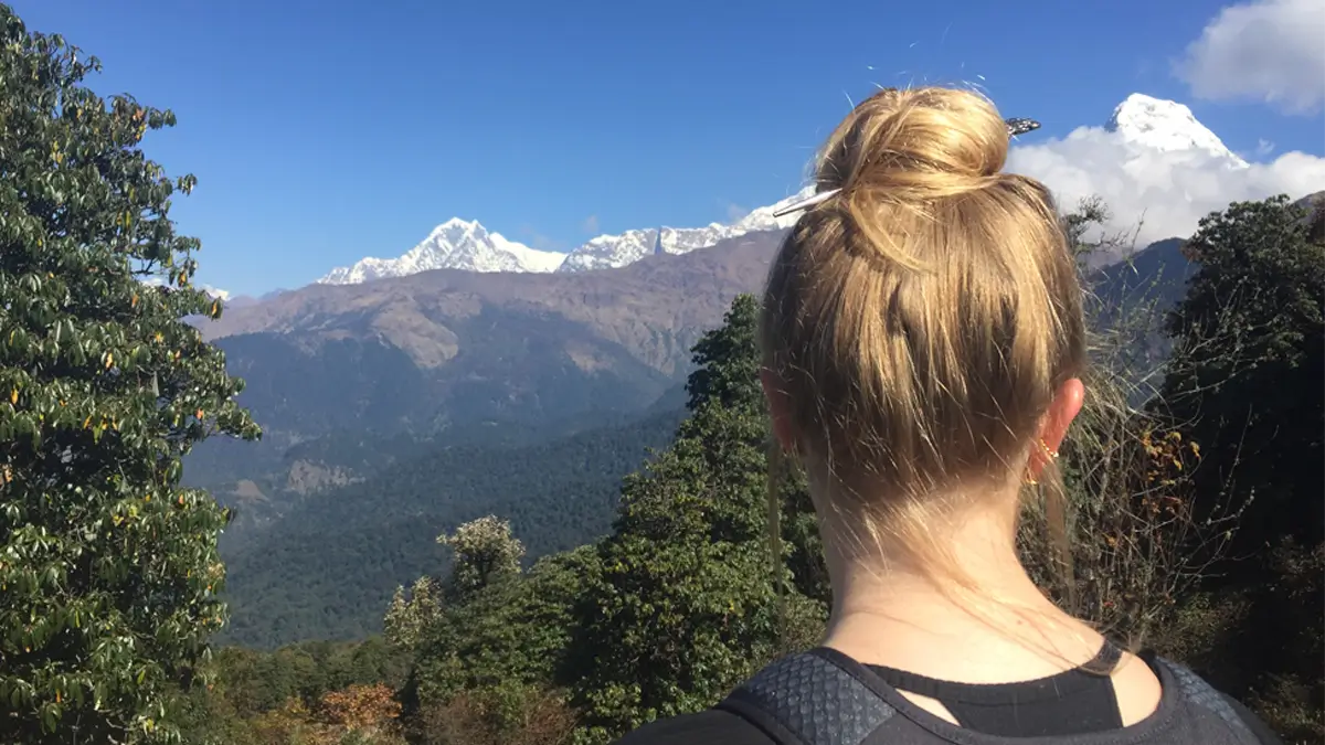 enjoying the annapurna view from poon hill way down to the ghorepani
