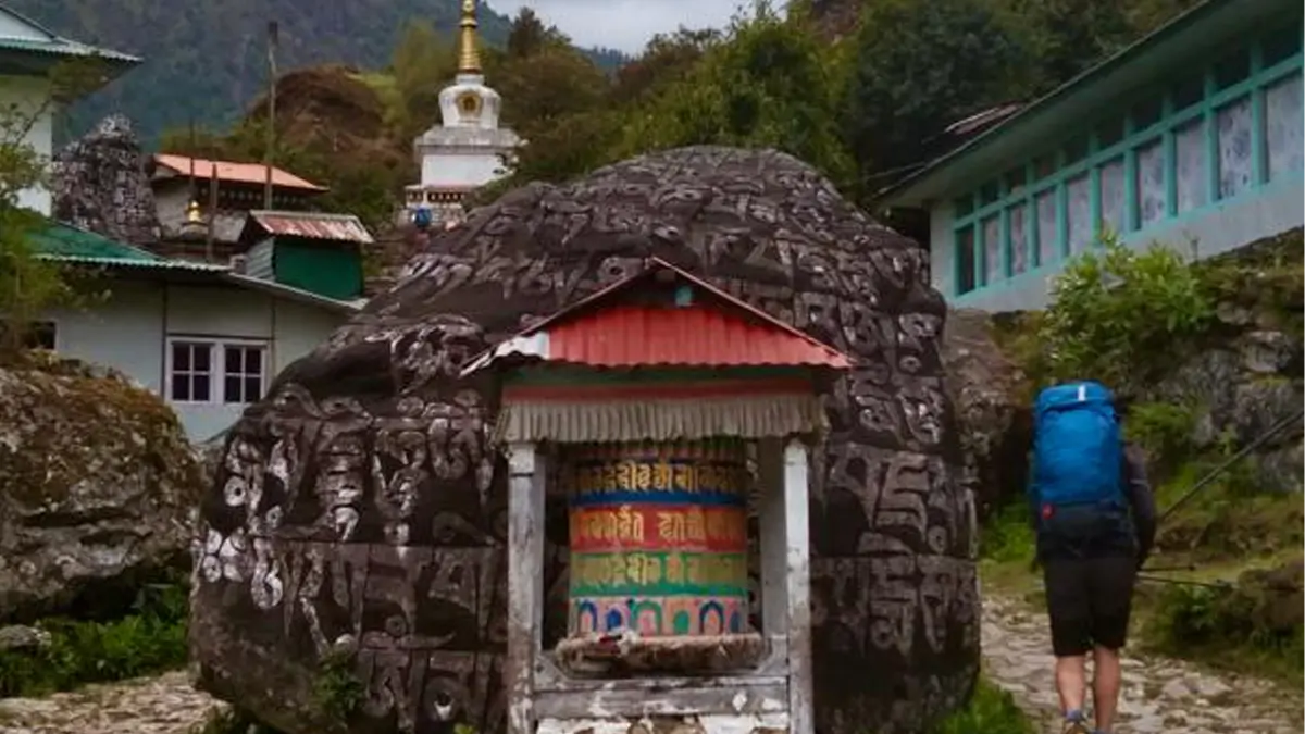 tibetan prayer wheels and mani stone along the trekking routes in everest base camp