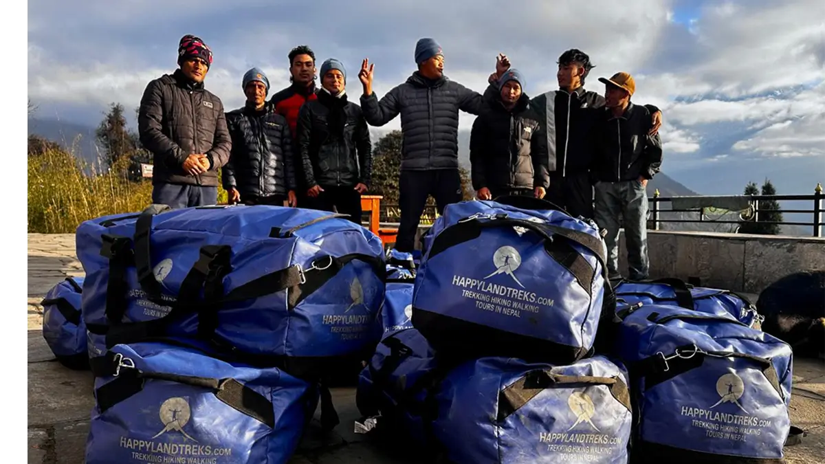 trekking porters in the himalayas in nepal