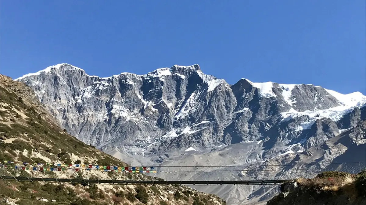 trekking trail and suspension bridge along the way to annapurna circuit trek in Nepal