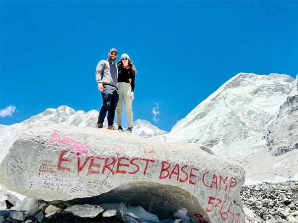 Taking a photo at Mount Everest base camp with our Irish trekkers from Happyland Treks